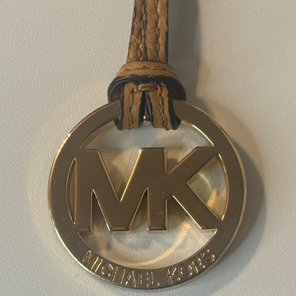 Michael Kors large gold-tone MK logo  brown leather strap hang tag